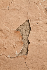 old wall with cracked plaster textured surface