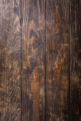 Grunge background of old brown wooden plank. Vertical stripes