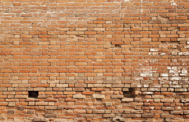 old brick wall with a textured surface