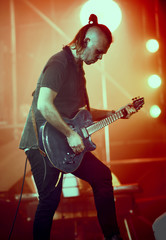 Obraz premium Guitarist performing on stage.