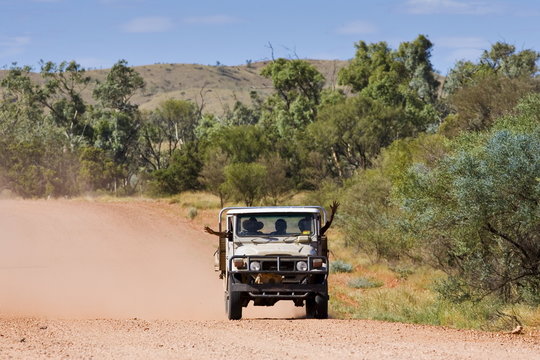 s in four-wheel-drive vehicle, Mereenie-Watarrka Road, Red Centre