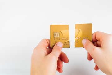 Credit cads cut in two pieces with scissors on white background
