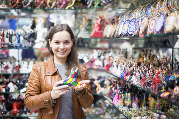 Female customer in souvenir shop.