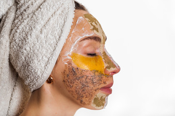 Woman with different masks on her face multi-masking