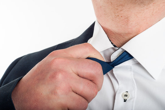 Man Is Loosening A Tie After Hard Work