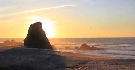 Sunset in a beach with a big rock. Santa Cruz Portugal