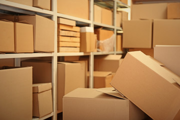 Modern warehouse full of cardboard boxes © Africa Studio