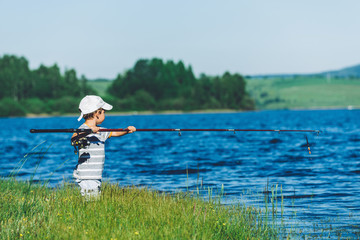 Funny little boy fishing