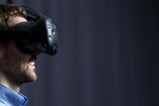 Attractive Man Wearing Virtual Reality Goggles. VR Headset