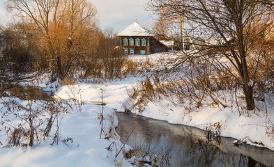 Winter rural landscape with the river