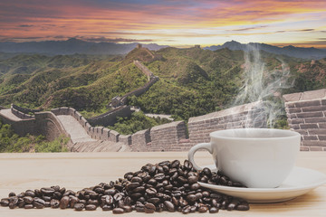 Coffee on wooden table with The Great Wall of China