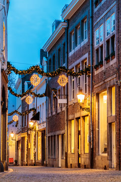 Shopping street with christmas lights in the city center of Maastricht