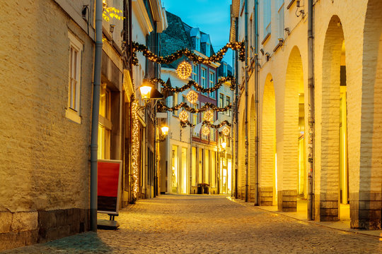 Shopping street with christmas lights in the city center of Maastricht