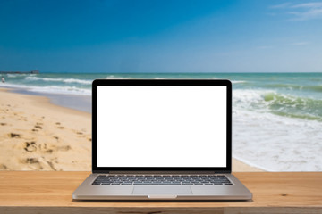office on the beach, laptop with empty scree