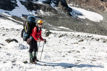 Hiker relaxing at mountains, Tien Shan, Kyrgyzstan.