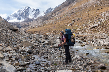 Fototapeta premium Hiker relaxing at mountains, Tien Shan, Kyrgyzstan.