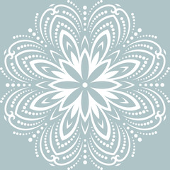 Round vector snowflake. Abstract winter ornament. Fine white snowflake