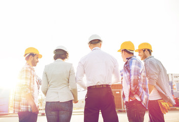 group of builders and architects at building site