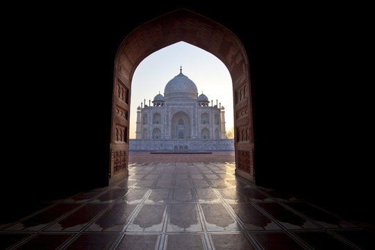 The Taj Mahal mausoleum western view (viewed from Taj Mahal Mosque with its prayer mat floor tiles) at dawn, Uttar Pradesh