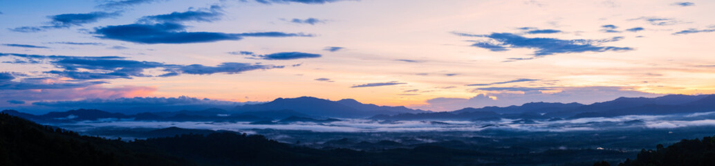 Fototapeta na wymiar Panorama of sunrise in the mountains.