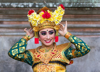 Portrait of a beautiful young female Balinese dancer in traditional costume. Bali, Indonesia.