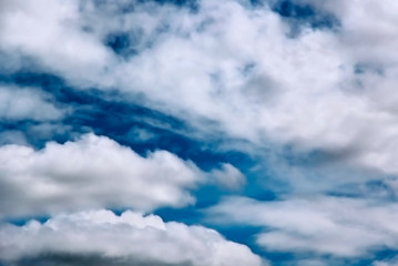 Blue sky with white fluffy clouds