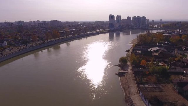 Aerial shot of the russian south city - Krasnodar. The river Kuban. 4K