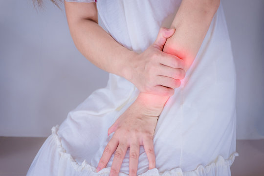 injury woman touching her painful  Arm ache .