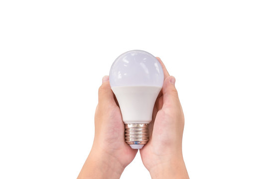 Closeup LED lighting bulb in hands isolated on white background, Concept for energy saving.