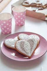 Cookies on a pink plate for Valentine's Day on white table