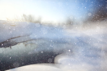Fototapeta na wymiar winter background blur forest snowflakes bokeh