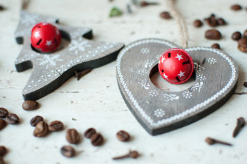 Wooden Christmas toys on the table. Tree, heart, coffee beans and spices. Rustic Christmas background.