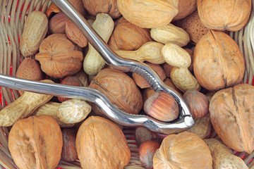 Mix of dried fruits with nuts, almonds, peanuts, walnuts and steel nutcracker