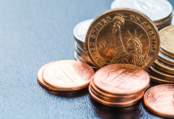 dollar coins stack on black