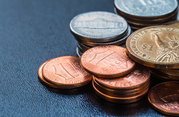 dollar coins stack on black