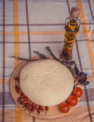 White cottage cheese with cherry tomatoes, red chili pepper and herbs. Farmer cheese on white...