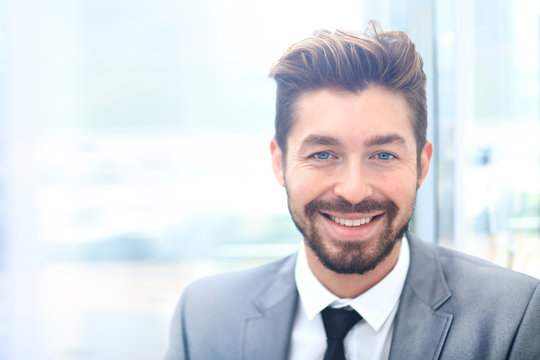 Portrait Of Happy Smiling Business Man, Isolated On White Background