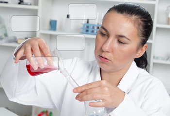 Fototapeta premium Young Female Scientist Analyzing Sample In Laboratory.laboratory assistant analyzing a sample