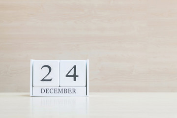 Closeup surface white wooden calendar with black 10 december wor