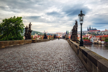 Panorama of Charles bridge and Prague castle in the early mornin