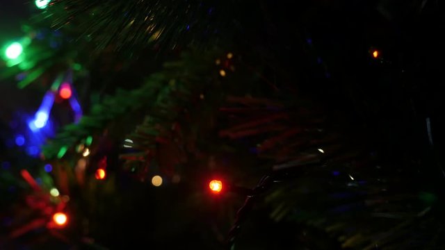Dot lights blinking at night shallow DOF 4K 2160p 30fps UltraHD footage - Christmas tree decorative colorful bulbs close-up 3840X2160 UHD video 