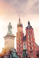 Fototapeta Church of St. Mary in the main Market Square on the background of dramatic sky. Basilica Mariacka. Krakow. Poland. obraz
