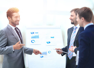 Business team discussing acquisition in meeting