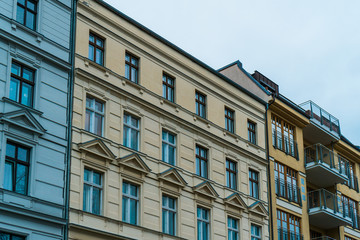 Fototapeta na wymiar white, yellow and orange facades of houses