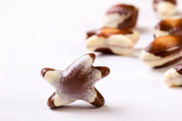 chocolate seashell on white table