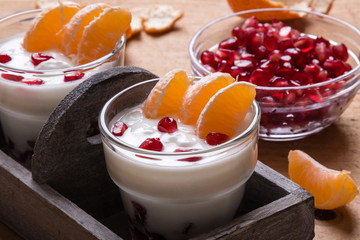 yogurt with pomegranate seeds and mandarin orange