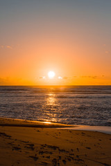 Fototapeta na wymiar Sunrise on the ocean beach in Praia do Forte, Bahia, Brazil