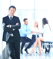 businessman standing with his team