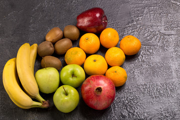 Fresh fruits on black texture background