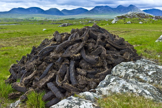 Stacked peat in turf bog on the Old Bog Road near Roundstone, Connemara, County Galway